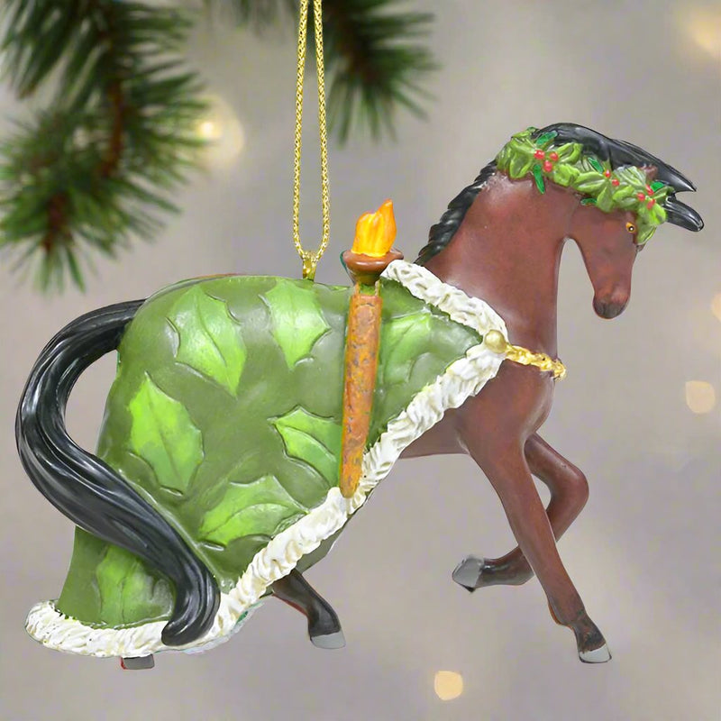 trail of painted ponies christmas present ornament hanging from Christmas tree branch