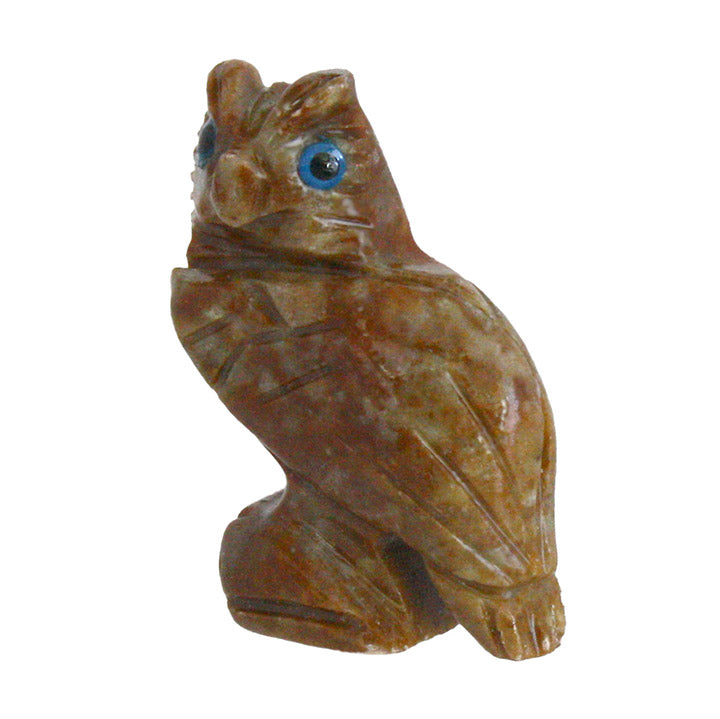 Brown soapstone horned owl figurine with blue eyes on a white background