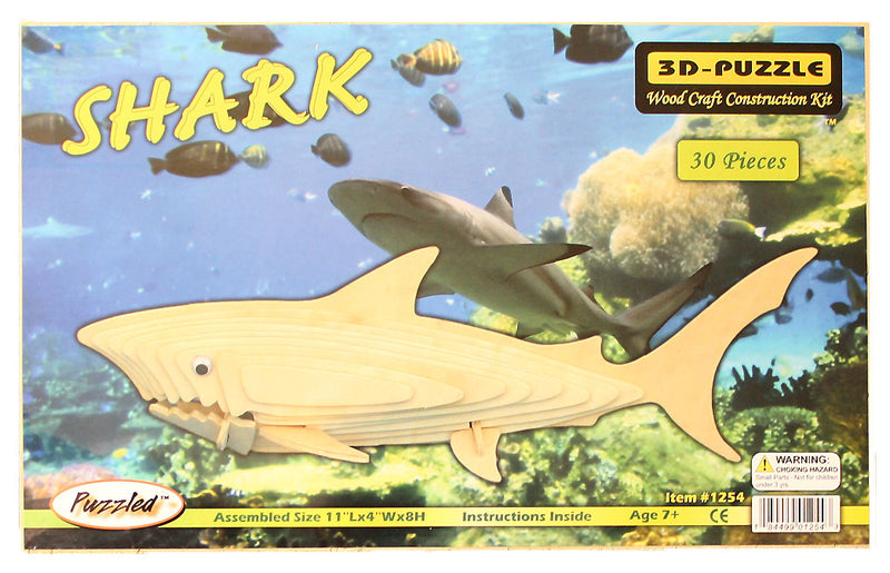 Shark-shaped 3D puzzle packaging with ocean scene background