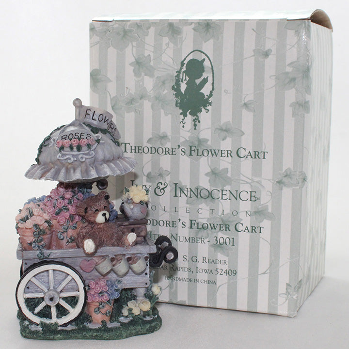 Decorative figurine of a flower cart with packaging labeled 'Theodore's Flower Cart'