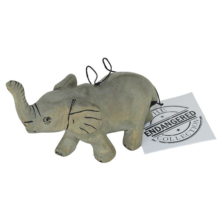 carved wood elephant ornament with endangered collection tag