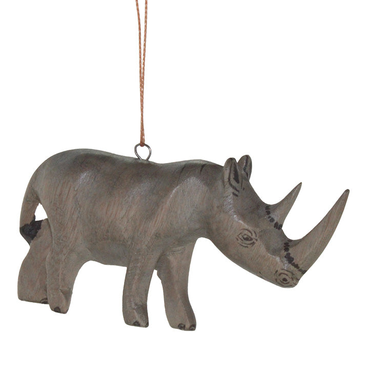 Decorative carved wood rhinoceros ornament on a white background