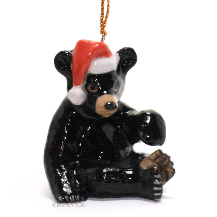 porcelain black bear with santa hat ornament facing forward right