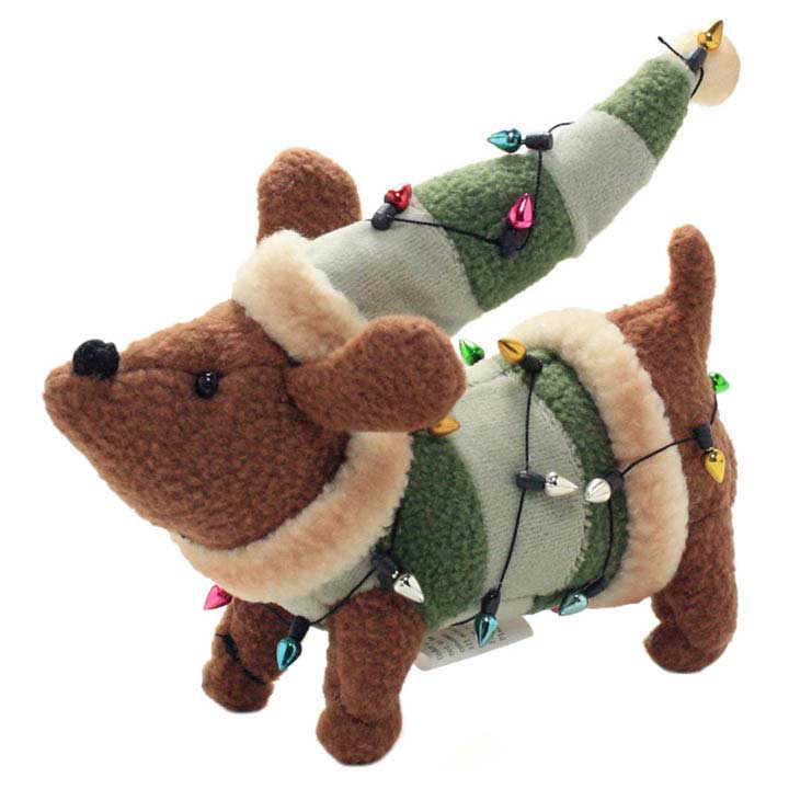 blossom bucket dog figurine - plush dachshund wearing green stripped sweather and hat wrapped in multi-colored lights facing left