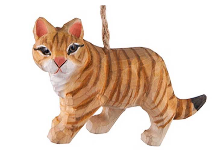 close up of hand carved wood orange and brown tabby cat with green eyes figurine ornament with natural jute hanger
