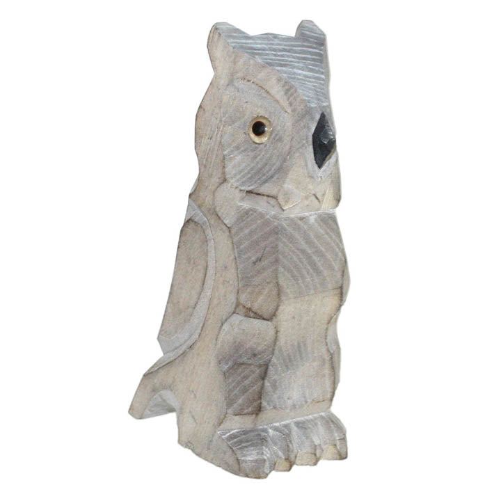 carved wood owl figurine facing right