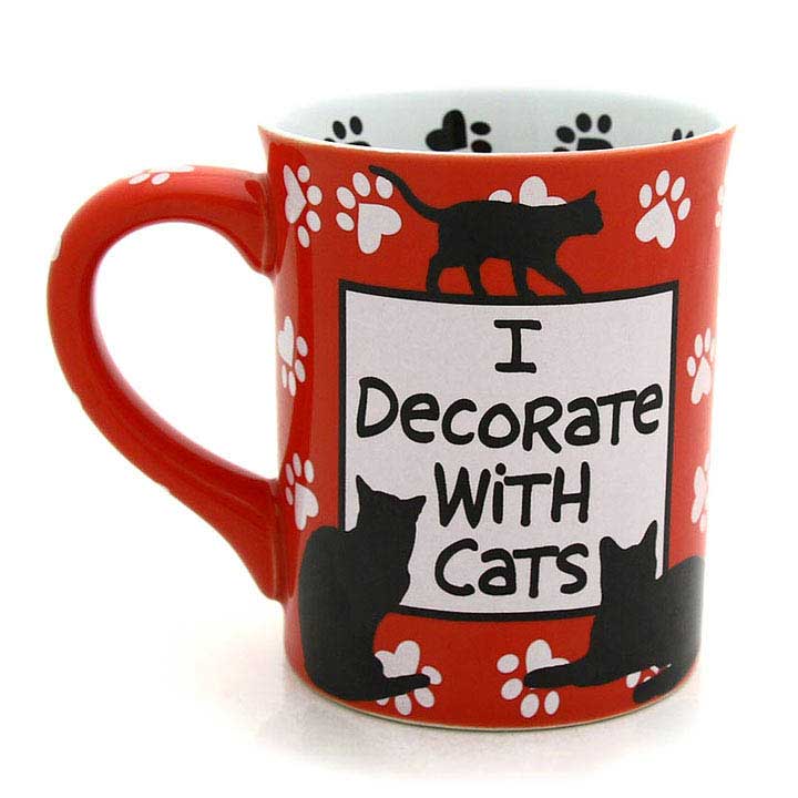 enesco, our name is mud, crazy cat lady mug - image showing red mug with white paw print design, white box with black I decorate with cats text and 3 sillouette cats with handle to left