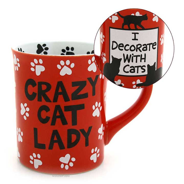 enesco 4026109 our name is mud, crazy cat lady mug - image showing red mug with black crazy cat lady text with handle to right and inset showing white box with black I decorate with cats text and black silhouettes of 3 cats