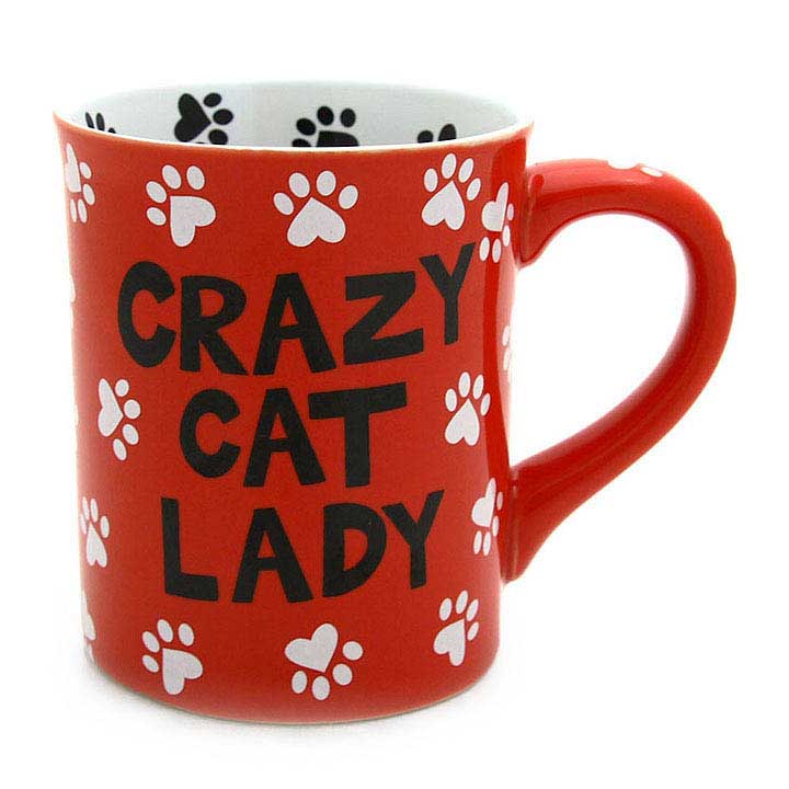 enesco 4026109 our name is mud, crazy cat lady mug - image showing red mug with white paw print design and black crazy cat lady text with handle to right