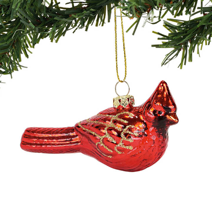 right side view department 56 glass red cardinal with glitter accented wings ornament hanging from christmas tree branch