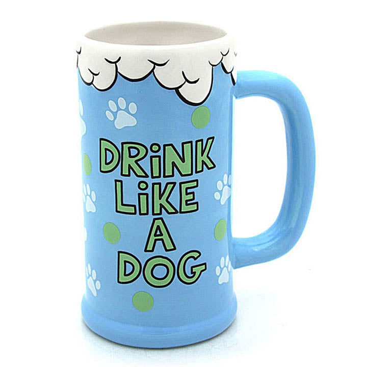 our name is mud blue mug with white "foam" at top and white paw print and green dot art image showing front text that reads "drink like a dog"