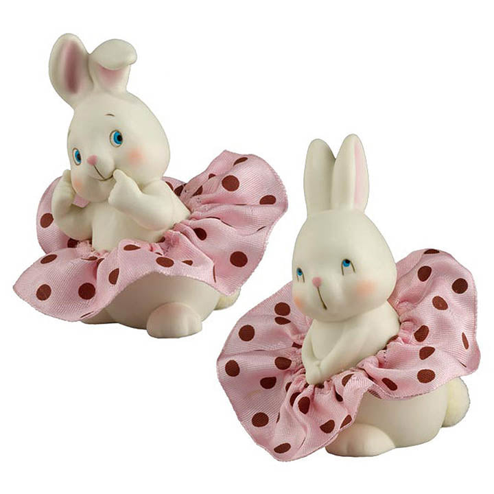 2 department 56 dottie collection white porcelain bunny figurines one with coy expression and one with curious expression on faces wearing a pink with red polka dotted ribbon tutu