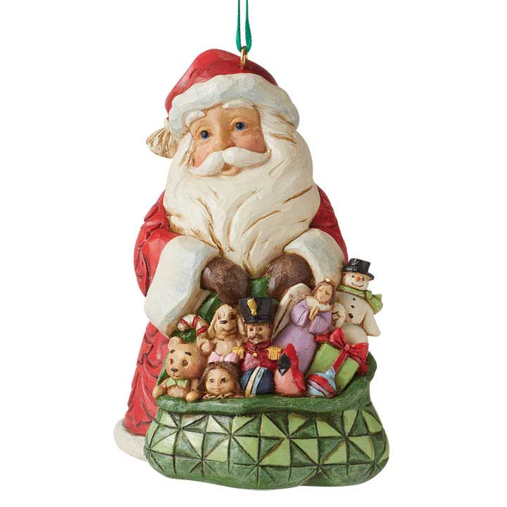 Enesco 6010832 Jim Shore Worldwide Event Santa Ornament - smiling santa holding a patterned green bag of assorted toys