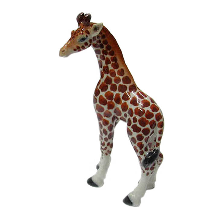 miniature porcelain giraffe looking left figurine side with view of tail