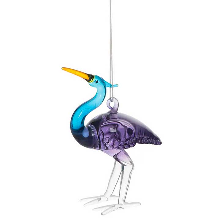 glass blue heron ornament - left side view  showing purple body, blue neck, yellow beak and white legs