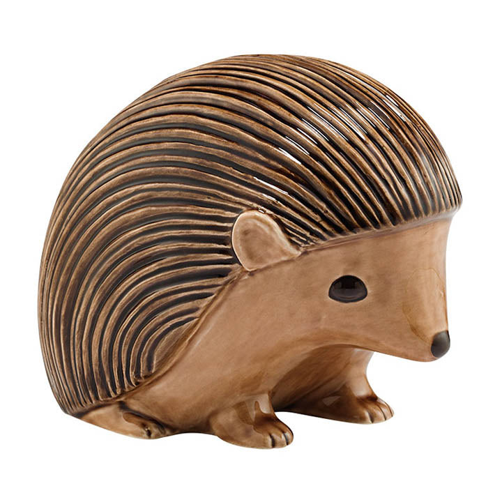 right side view of brown glazed ceramic department 56 hedgehog looing down figurine
