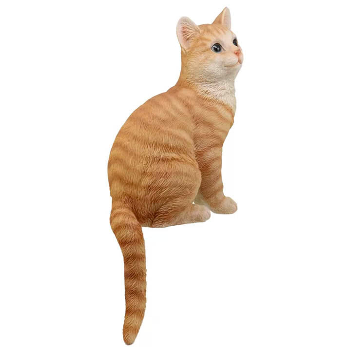 right side view of orange tabby cat with green eyes facing right shelf sitter figurine