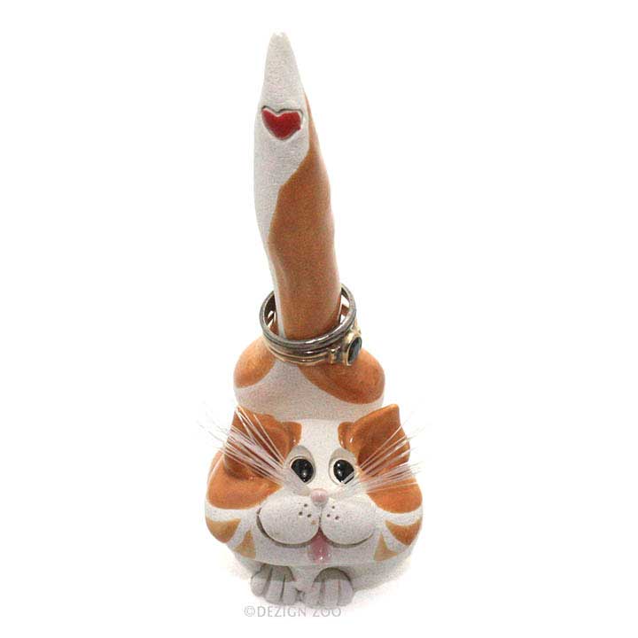 front view - one of a kind glazed ceramic orange tabby cat with red heart design on tail figurine, ring holder with two rings around tail