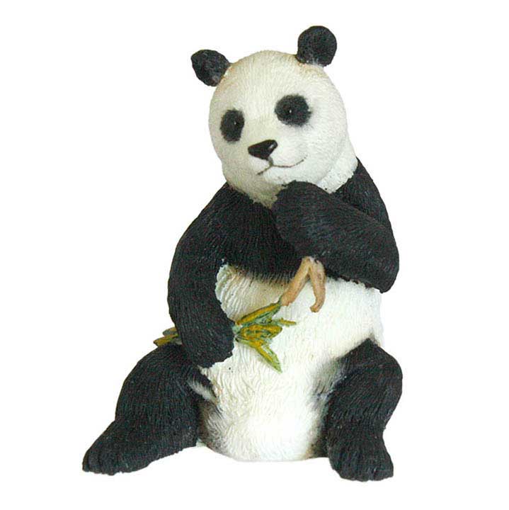 front view of country artists brand minature figurine of sitting giant panda holding bamboo branches in both paws