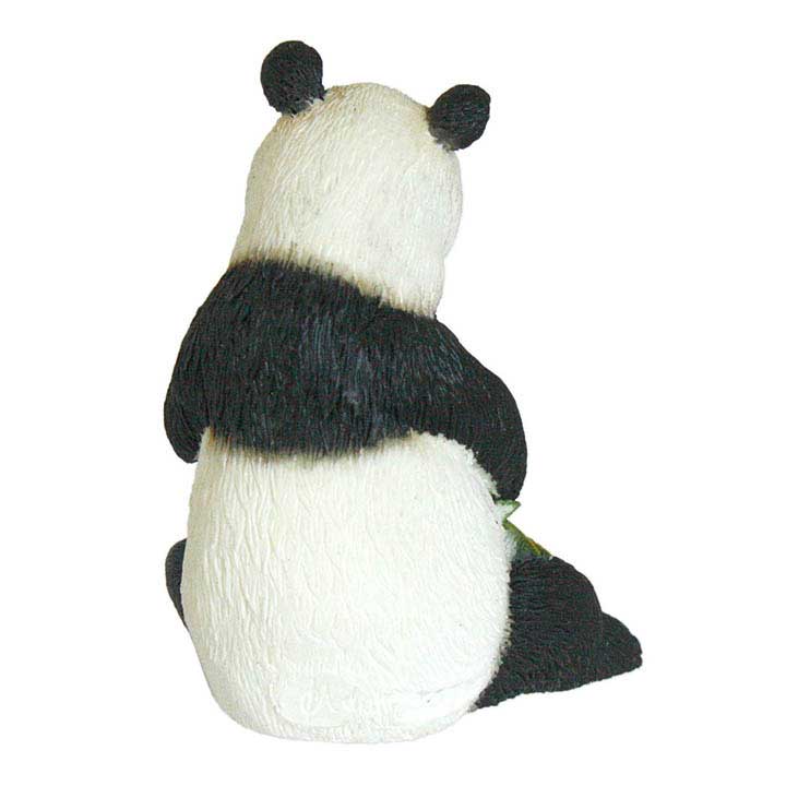 back side view of country artists brand minature figurine of sitting giant panda holding bamboo branches in both paws