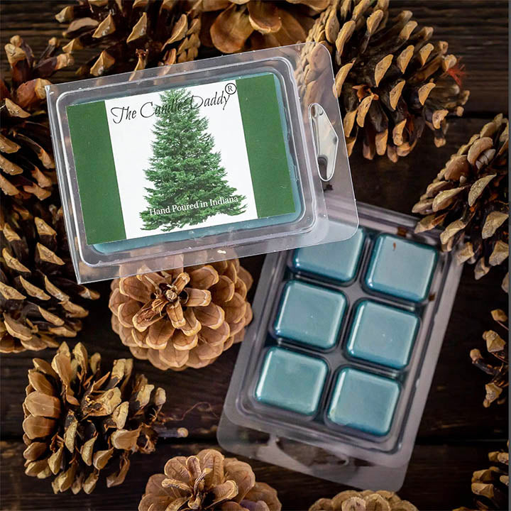 candle daddy spruce pine tree scented wax melts in container on top of table with pinecones