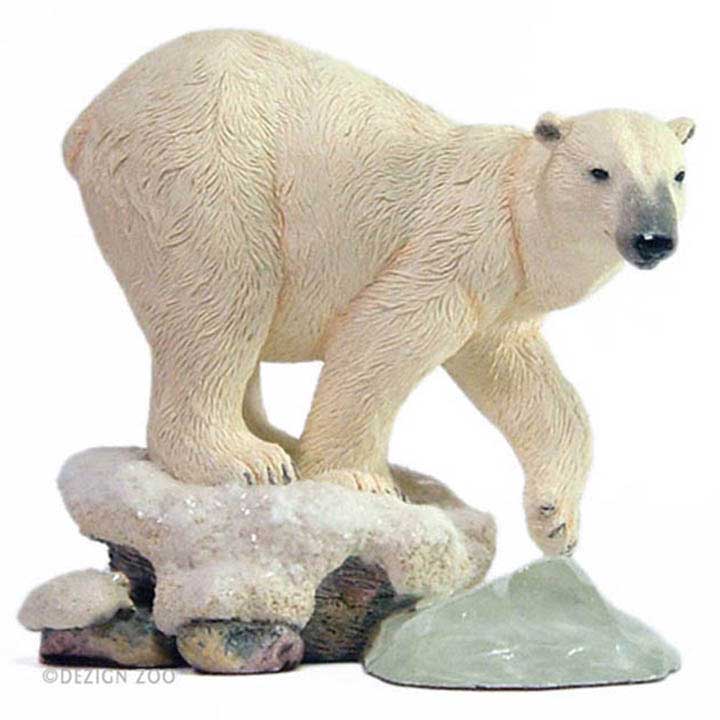country artists brand figurine right side view of polar bear facing right stepping off snowy ground onto piece of blue green ice