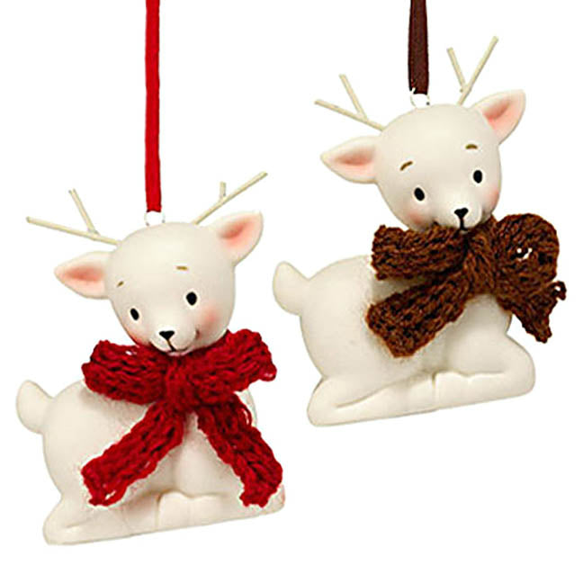department 56 white porcelain deer with antlers ornaments, one wearing a red bow the other a brown bow hanging from color coordinating ribbons