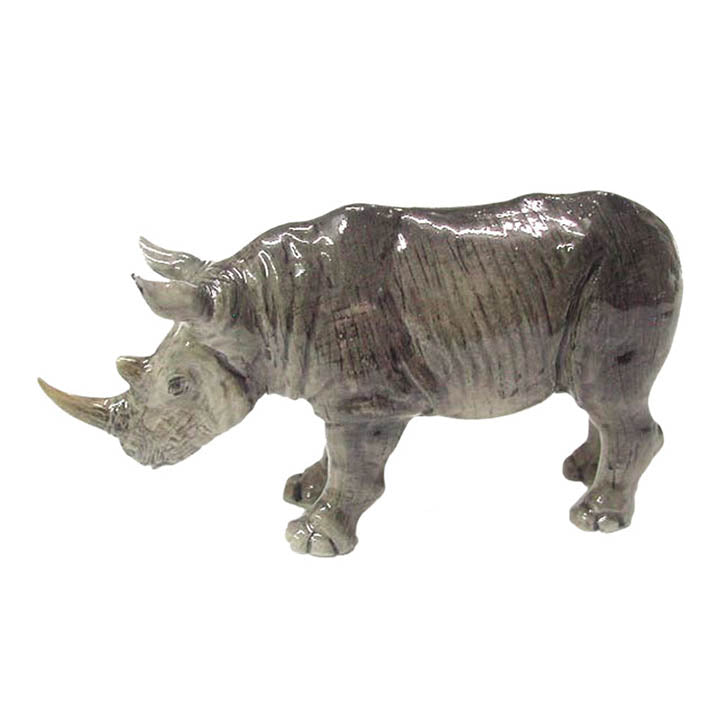 minature porcelain rhinoceros standing facing left wildlife jungle animal figurine