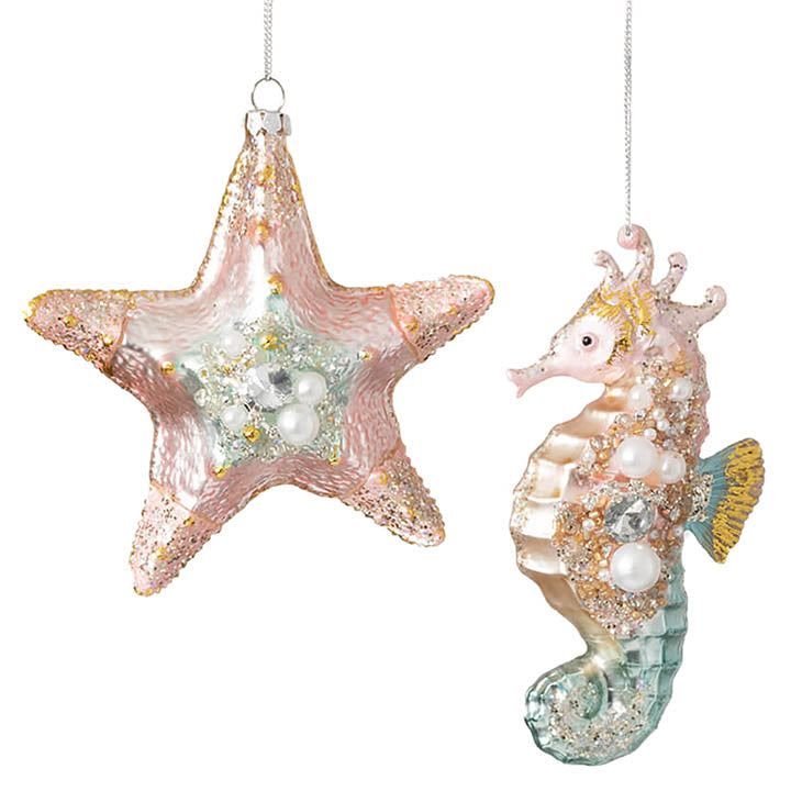 glass pastel pink and blue starfish and seahorse ornaments with faux pearl, rhinestone and glitter accents hanging from silver colored cords