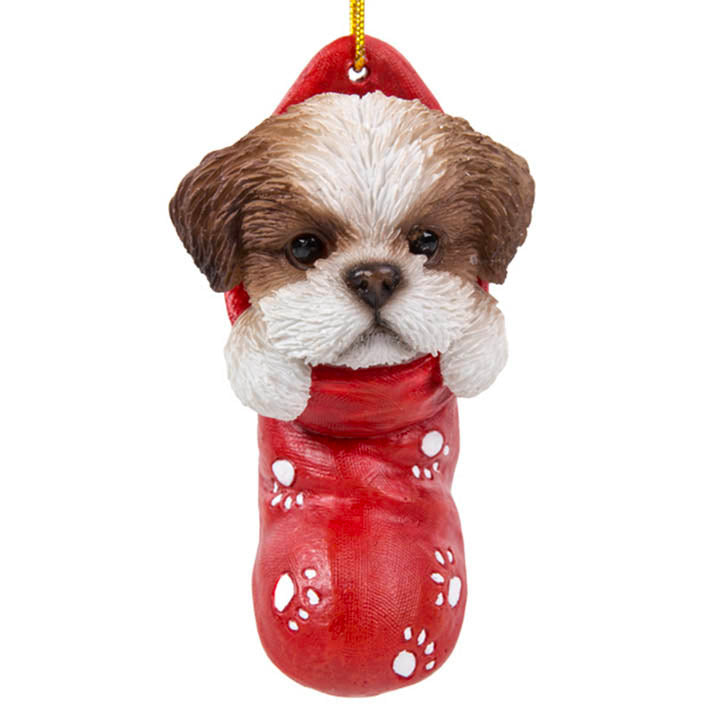 close up view of shih tzu puppy in red stocking with white paw print designs christmas ornament