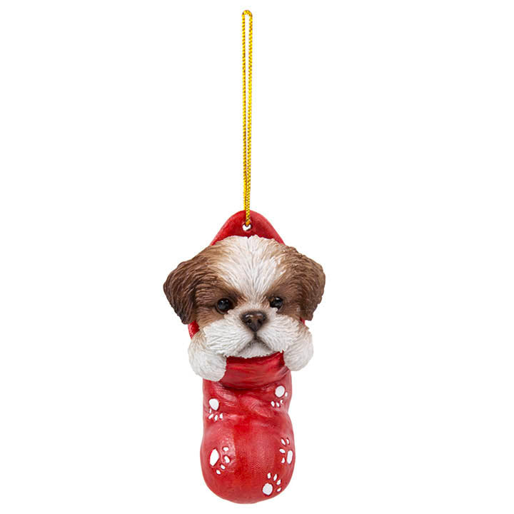 full view of shih Tzu puppy in red stocking with white paw print designs christmas ornament hanging from gold colored cord