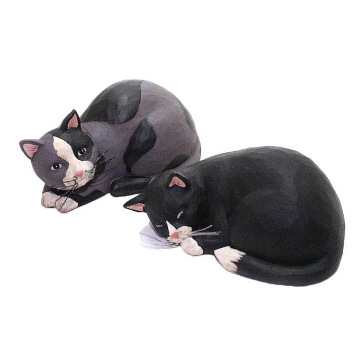 blossom bucket cat figurines; left cat is black and gray laying down, right cat is a black and white tuxedo sleeping