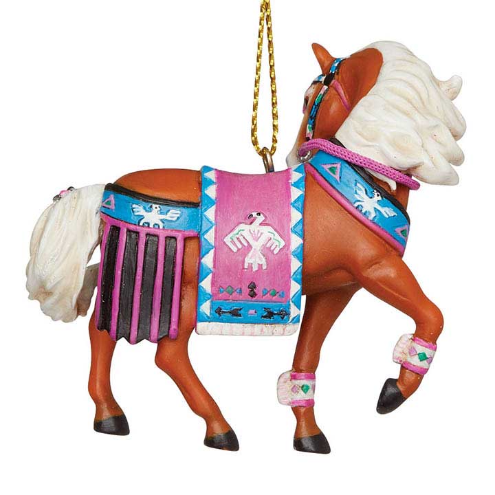 trail of painted ponies thunderbird ornament, palamino horse with blue and pink thunderbird art riding gear - closeup, right side, back of head view