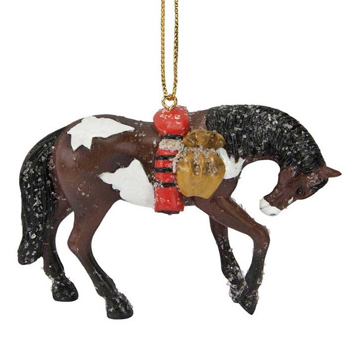 trail of painted ponies 4040985 trail of tears ornament, a brown and white paint horse with head lowered carrying a blanket and satchel covered in snow - right side, close up view