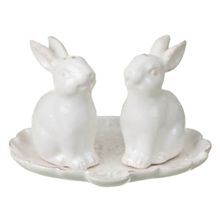 front view antique finish white ceramic bunny salt and pepper shakers sitting on white ceramic tray