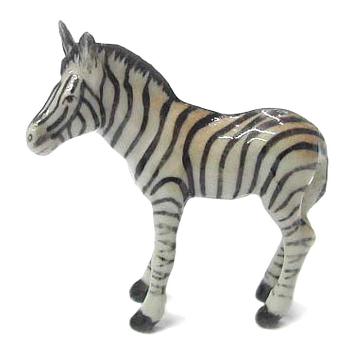 miniature porcelain zebra foal standing facing left figurine side view